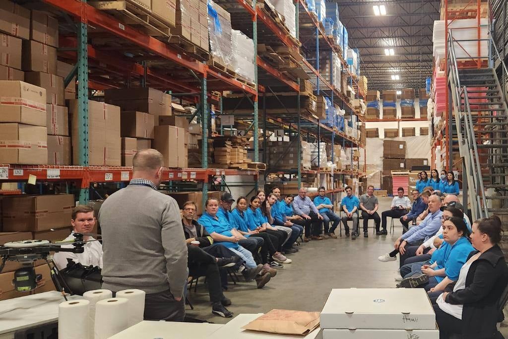 Team meeting in warehouse